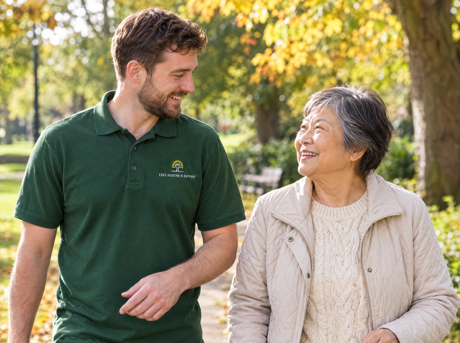 Eden companion carer on a walk in the park with an older woman in Telford