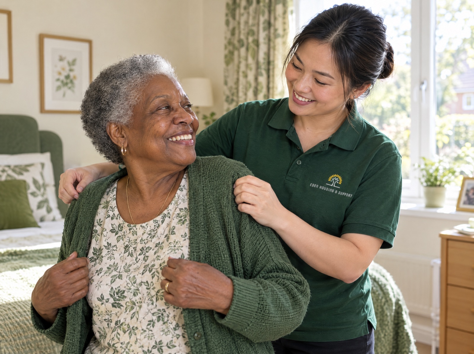 Eden carer helping an older woman dress at the start of the day in Telford