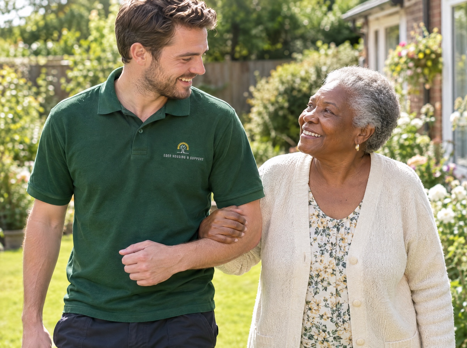 Eden live-in carer supporting an older woman in her garden at home in Telford